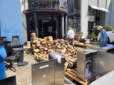 Piles and piles of waterlogged boxes outside the CETA office. (Credit: Scott Carden)