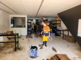 Inside the CETA office after some of the rubble is removed. (Credit: Scott Carden)